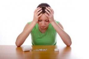 Teenage girl looking at medication