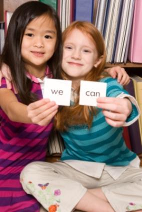 Two girls with flashcards