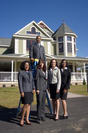 Businessman and women outside house