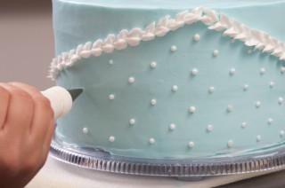 Decorating a blue cake