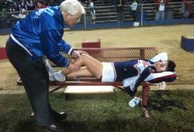 Dr. Vangsness with injured cheerleader