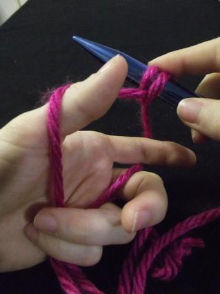 Step six of casting on for knitting: A completed cast-on stitch, ready to start on the next one.