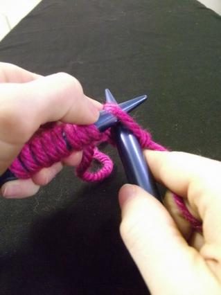 Step three of knitting a knit stitch