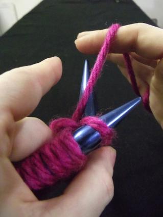 Step four of knitting a knit stitch