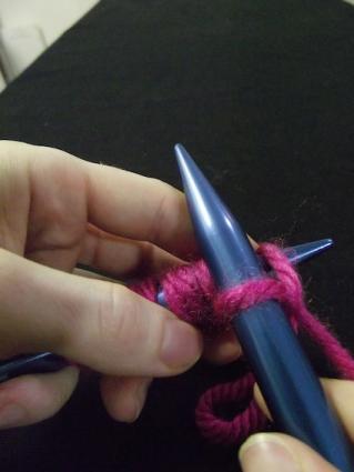 Step seven of knitting a knit stitch