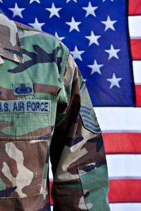 soldier in front of american flag