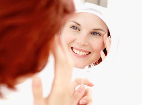 Woman looking in mirror