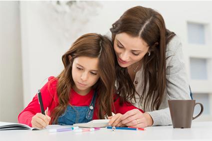 Mother helping daughter with homework