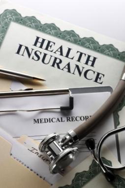 Stethoscope and health insurance forms