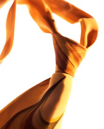 a yellow necktie with a perfect knot