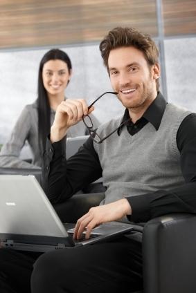 Man in dress shirt and sweater vest