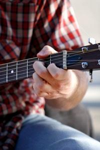 Man playing a guitar