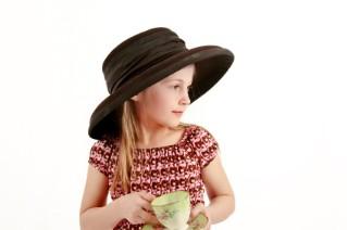 girl in a hat with teacup
