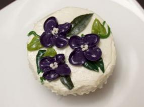 A cupcake decorated with flowers.