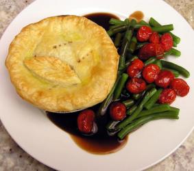 A pot pie with vegetables.