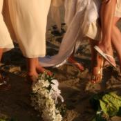 bride and bridesmaids' shoes on beach