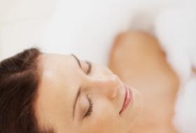 A woman relaxing in a bubble bath