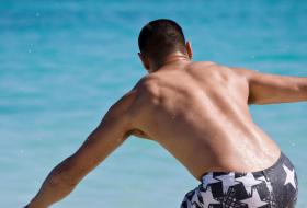 Surfer in board shorts