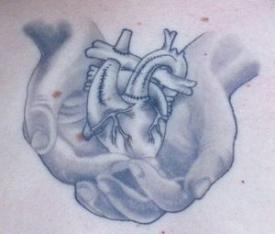 Heart in hands tat