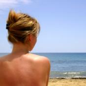 woman topless at beach