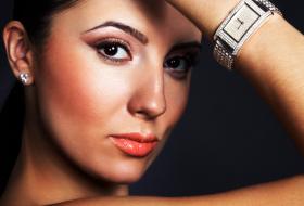 Woman wearing silver watch.