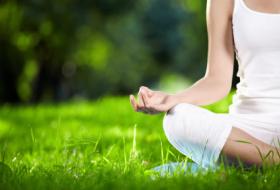 yoga pose om knees hands grass
