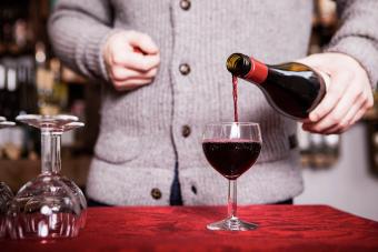 Sommelier pouring red wine