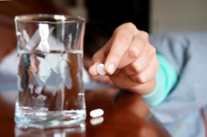 Womantakingsleepingpill.jpg