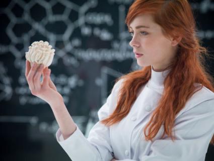girl holding a mushroom