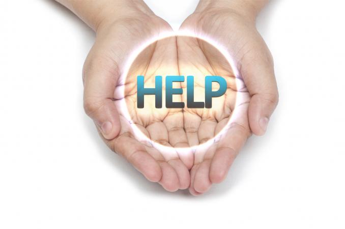 Hand Holding the word HELP