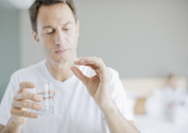 Man taking medicine