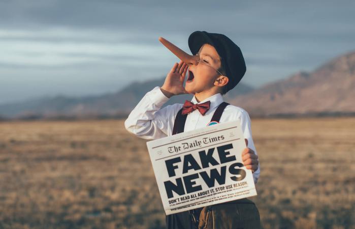 Pinocchio News Boy Holding Fake Newspaper