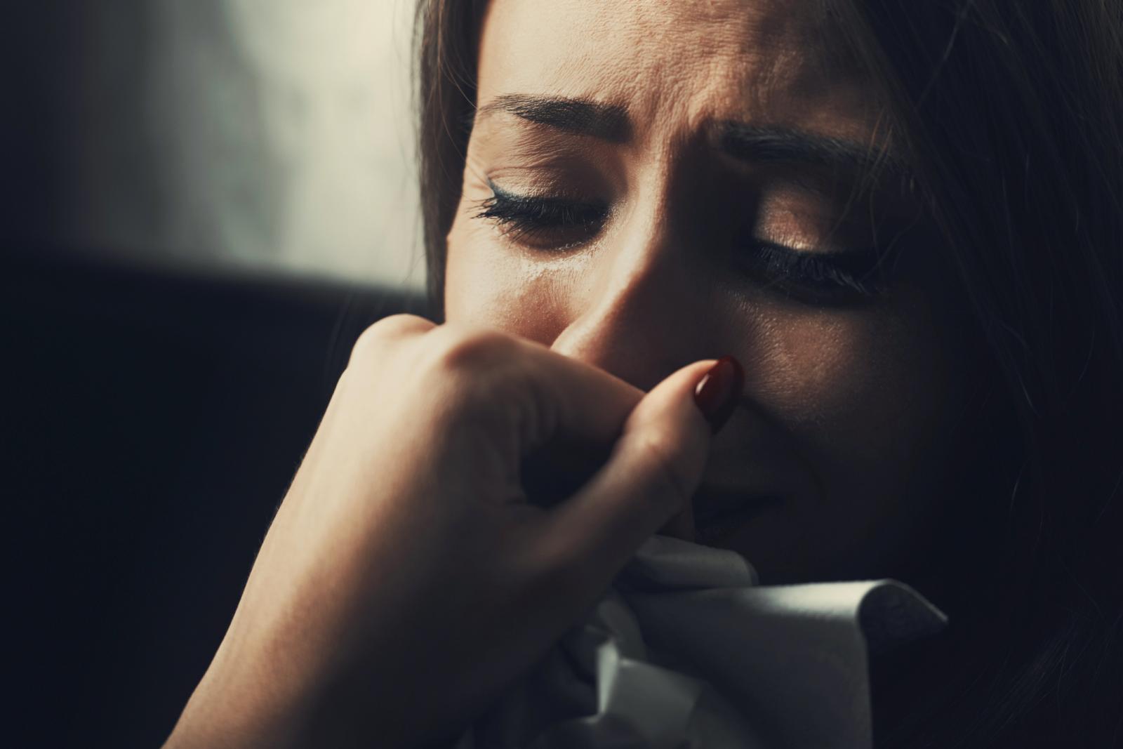 Depressed young woman crying