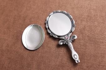 Hand mirror on a table