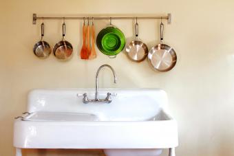 Antique kitchen farm sink with hanging pots