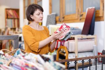 woman shopping for vintage retro print fabric