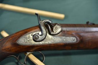 Collectible flintlock rifle by Hollis and sons on display at the Great British Shooting Show