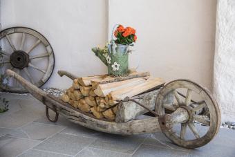 Old traditional pushcart, wheelbarrow with firewood 