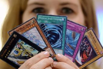 A participant presents a bunch of Yu-Gi-Oh cards at the German Yu-Gi-Oh! Trading Card Game Championships - Getty Editorial Use