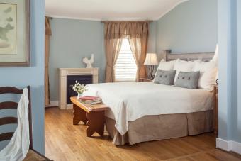 Blue Bedroom with antique wooden bench