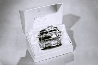 A silk lined giftbox containing a highly polished silver Varaflame cigarette lighter made by Ronson for Harrods. 1962