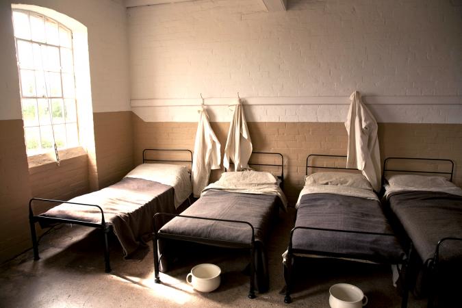 Dormitory in an old English Victorian Workhouse with Chamber Pots