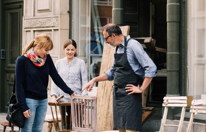 Woman buying antique furniture