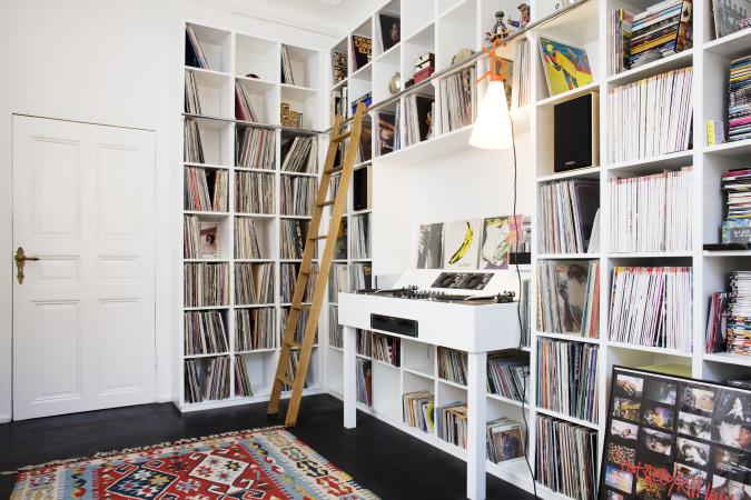 music room featuring record storage in a wall unit