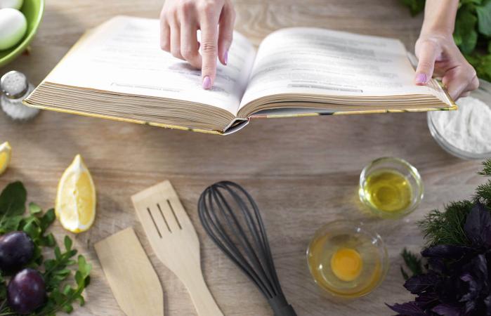 Lady reading in culinary book