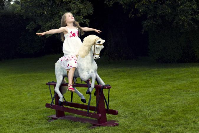 Girl on a rocking horse