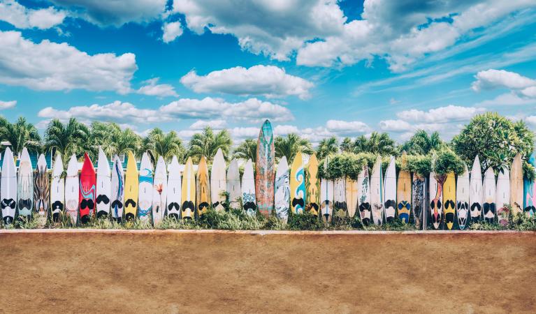 Retro Version old surfboards lined up in Hippie Town in Hawaii