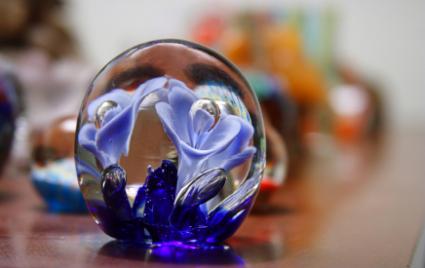 An antique paperweight with floral design.