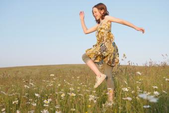 Young girl marches in meadow