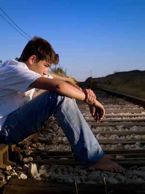 Boy sitting alone
